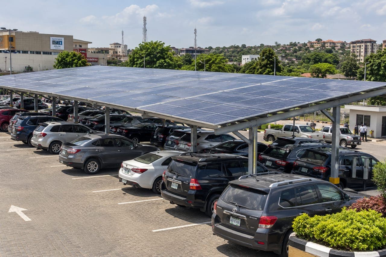 Solar canopy installed above a paved parking area